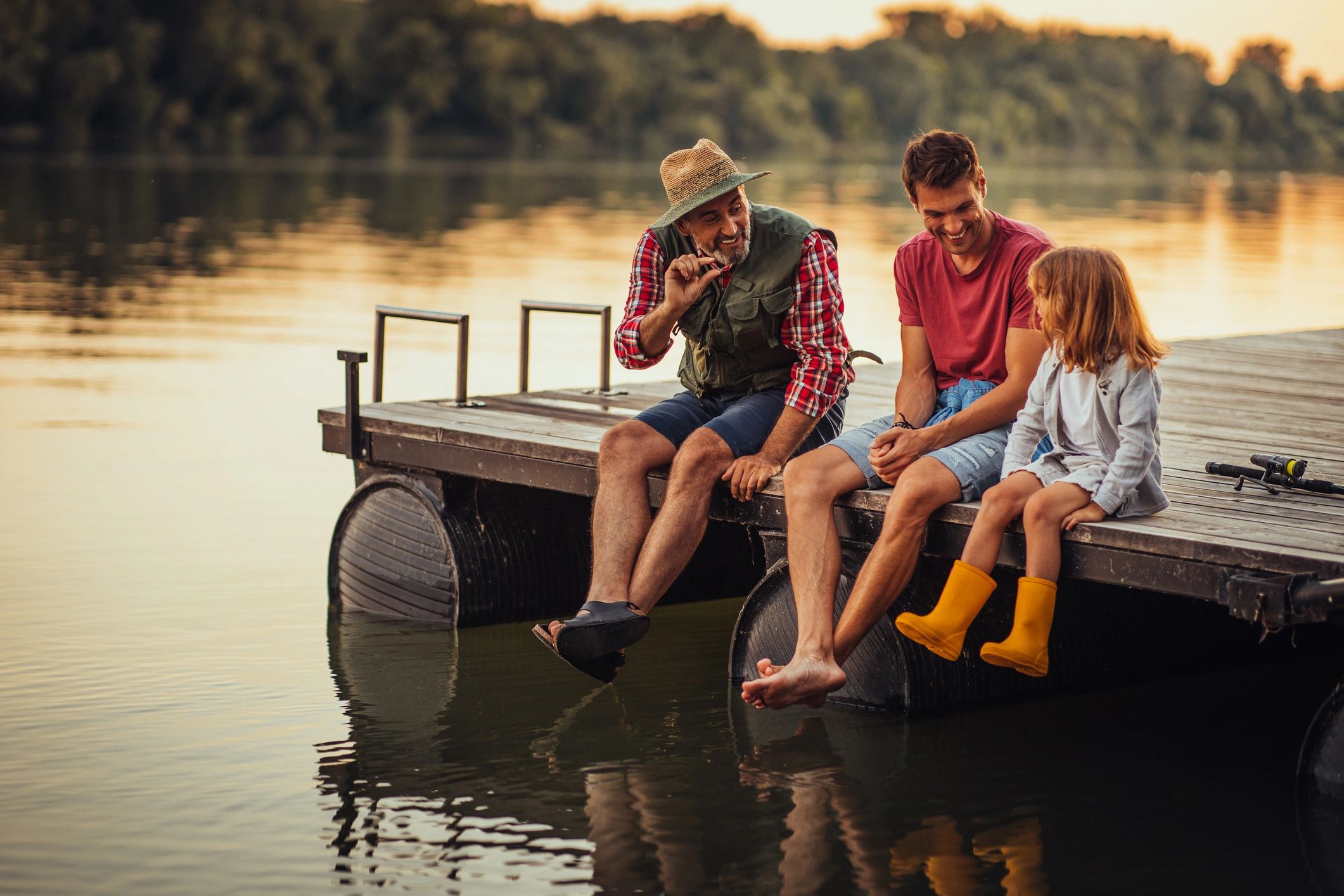 family enjoying pontoon boat on lake